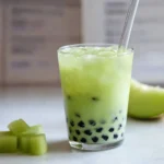 Honeydew Bubble Tea Recipe – Refreshing, Creamy & Easy to Make 9 Served honeydew bubble tea with ice, tapioca pearls, and mint garnish